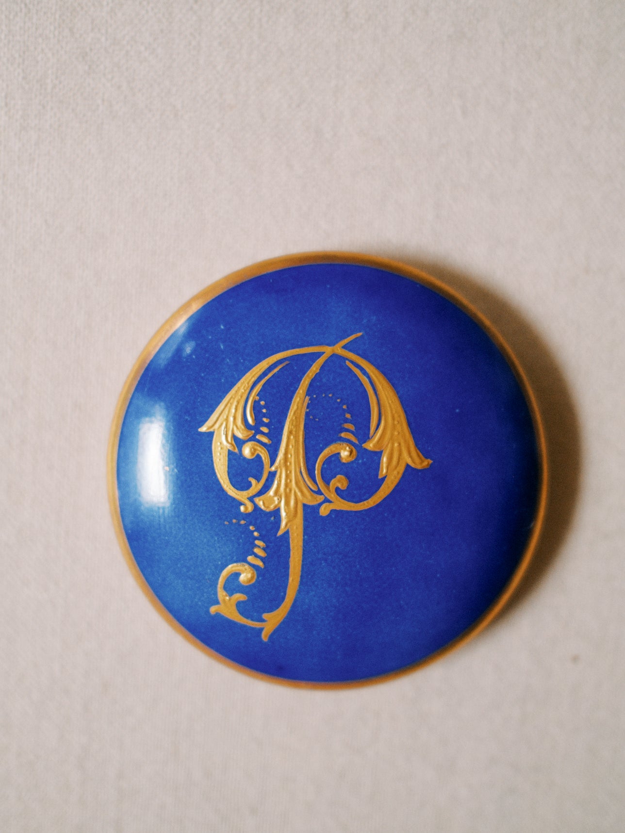 Gilded "P" Porcelain Piece