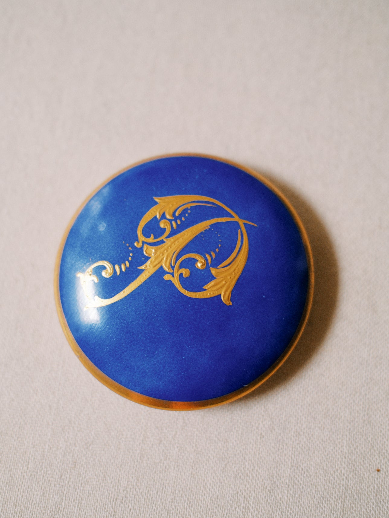 Gilded "P" Porcelain Piece