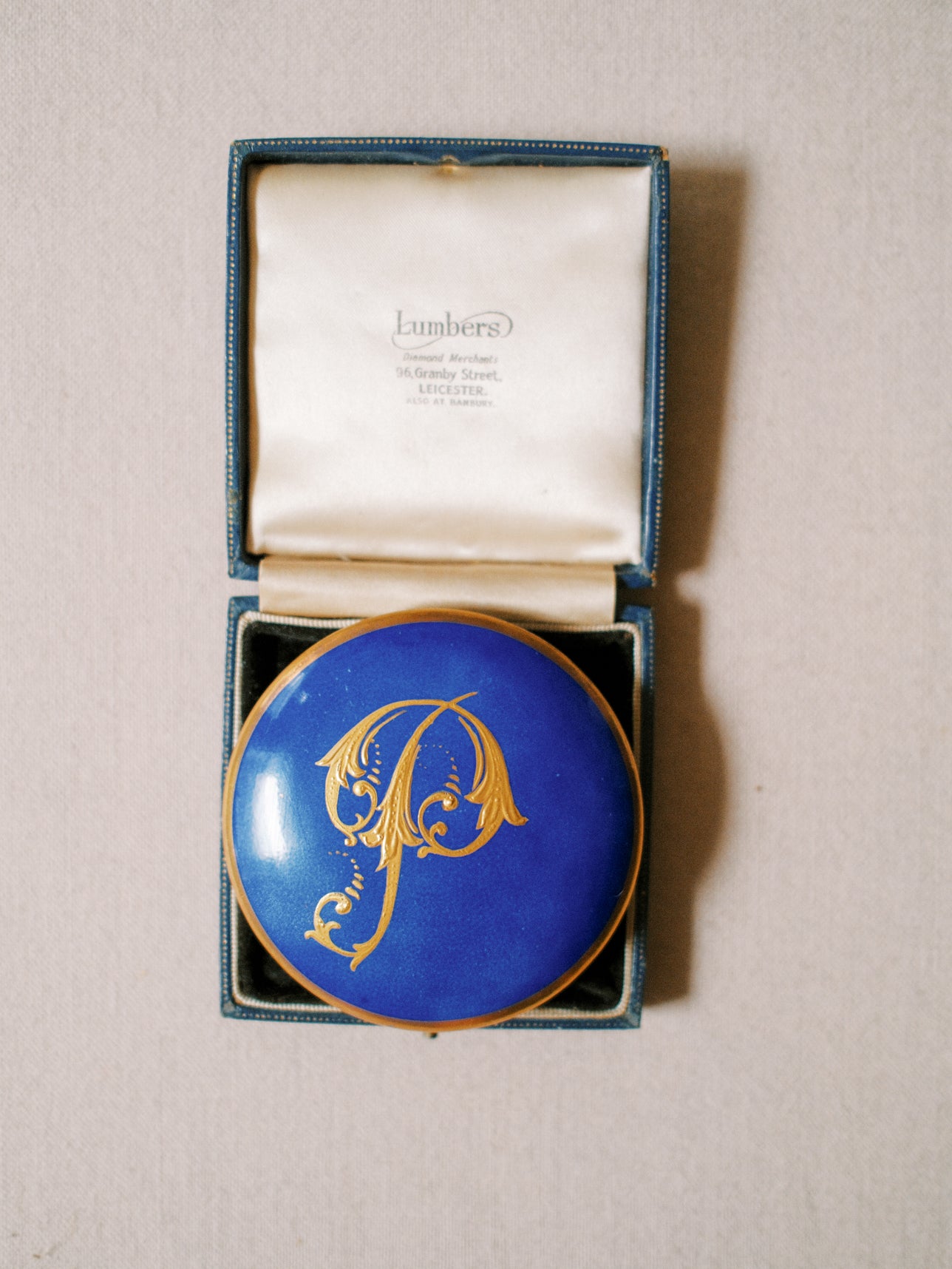 Gilded "P" Porcelain Piece